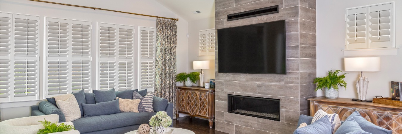 Plantation shutters in Yorba Linda family room with fireplace