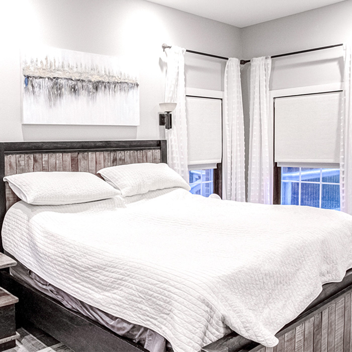 Gray motorized shades inside a city bathroom loft.