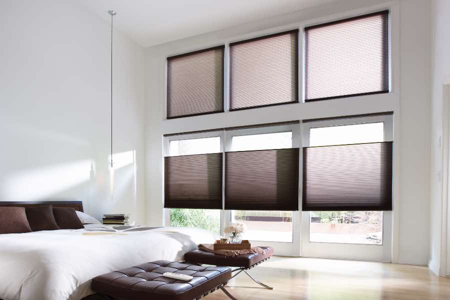Top-down, bottom-up cellular shades covering windows in stylish bedroom