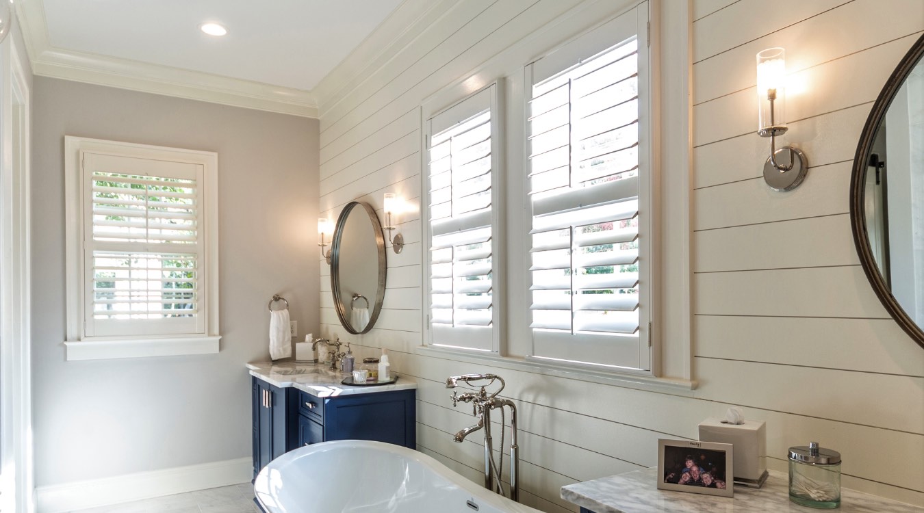 Southern California bathroom with white plantation shutters.