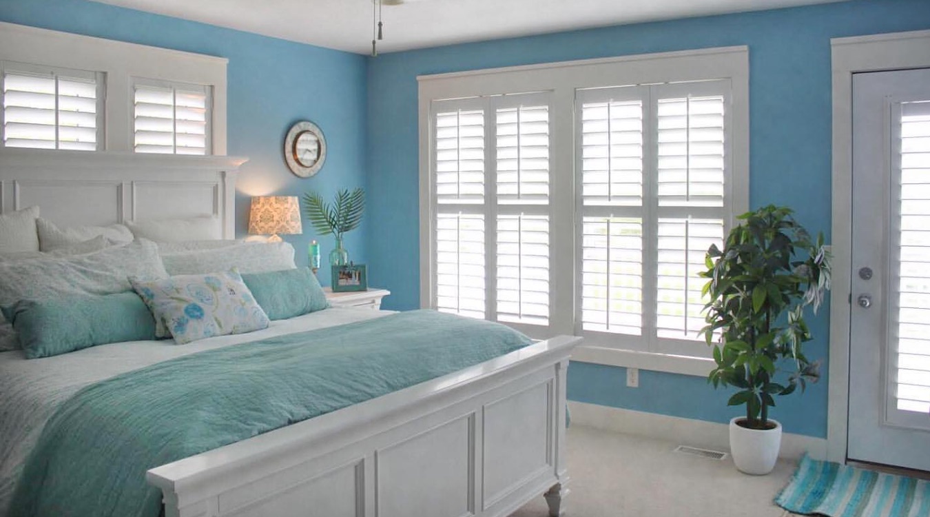 Bedroom with interior shutters