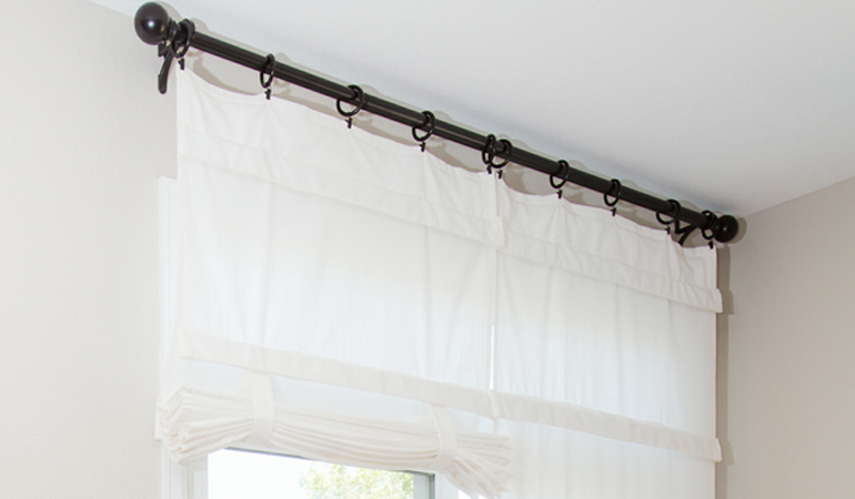 Tumble shades in Southern California give your doors privacy versatility and style. White tumble shade on double glass doors