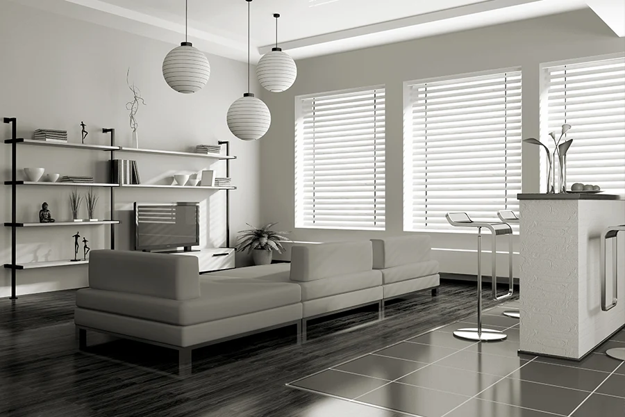 Skip the store and hire the pros to measure, customize, and install your new blinds. White blinds on windows in a white living room