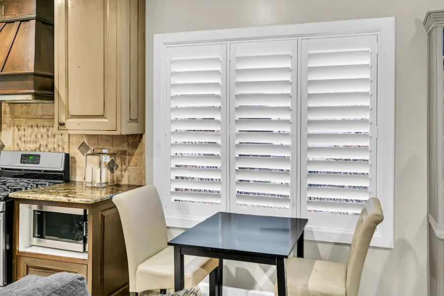 Polywood shutters are the highest quality faux wood shutters and the most reliable. White Polywood shutters on a kitchen window